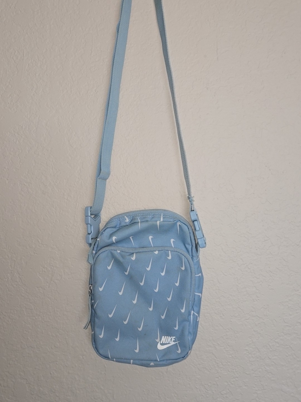 Nike Light Blue Crossbody Bag with White Swoosh Pattern